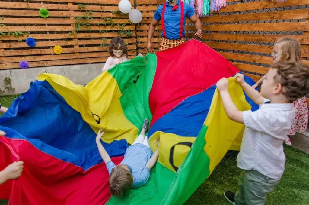 kids playing with a parachute
