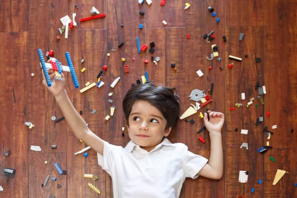 boy playing with Lego